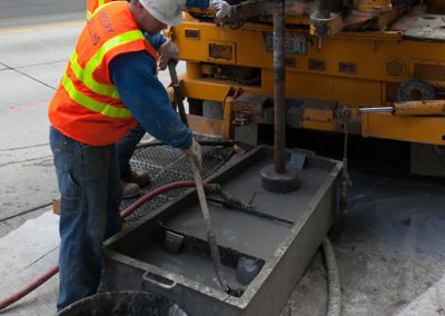 Monitoring tailings as they are sucked into a vacuum truck keeping the site clean throughout drilling.